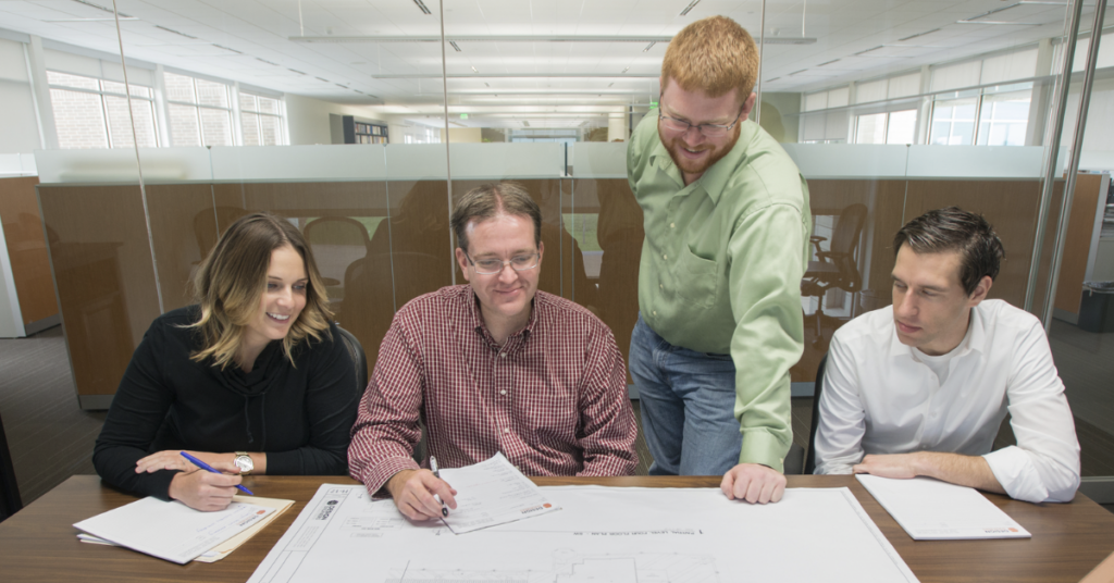 Design Engineers employees collaborating on a project.