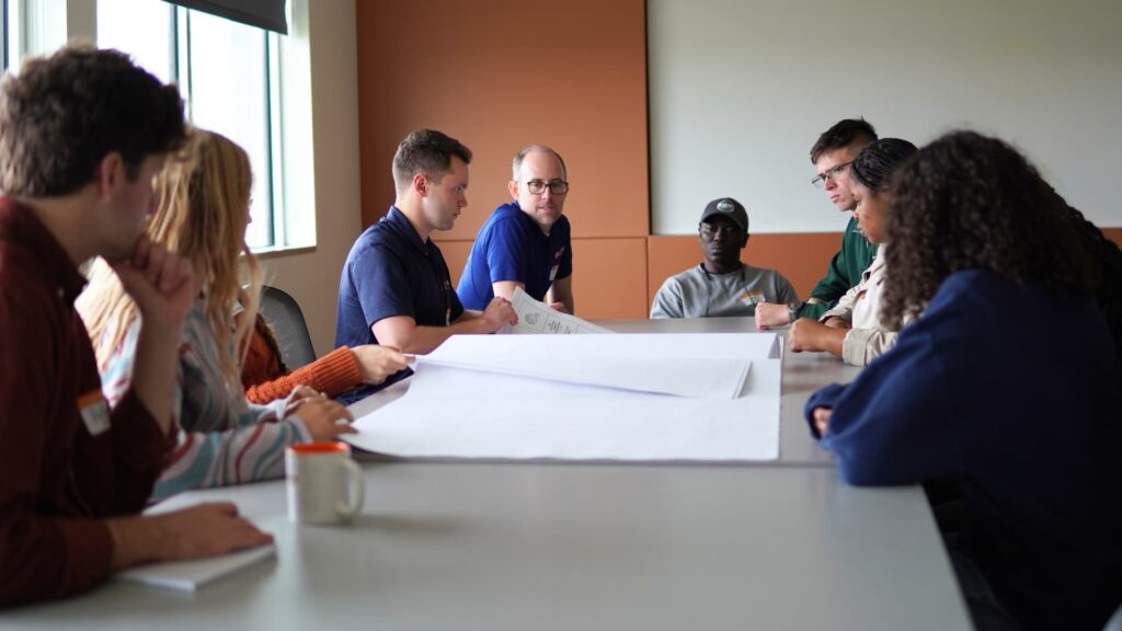 Students from the Engineers Without Borders Chapter at Iowa State University and Kwame Nkrumah University of Science and Technology collaborate with engineers at Design Engineers.