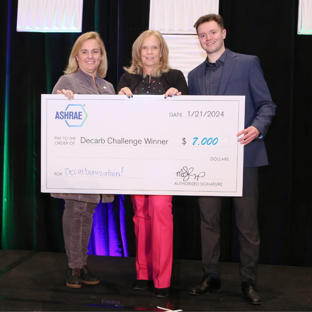 Sam Stinson receiving $7,000 grant cheque from ASHRAE president Ginger Scoggins and Region IV Director and Regional Chair Susanna Hanson.