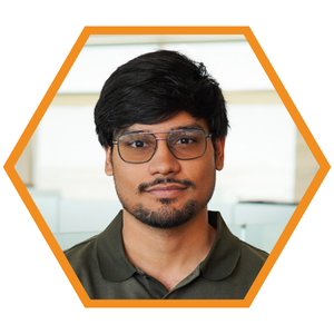 Headshot of Mechanical Engineer Ahmed Bilal in an orange hexagon frame.